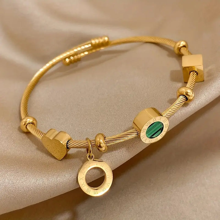 Gold Band with a Green Gemstone