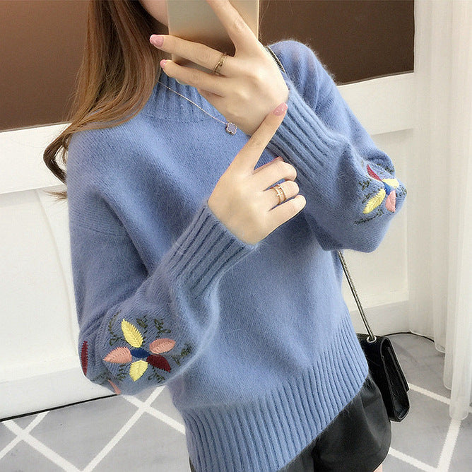 Warm knitted sweater in solid color