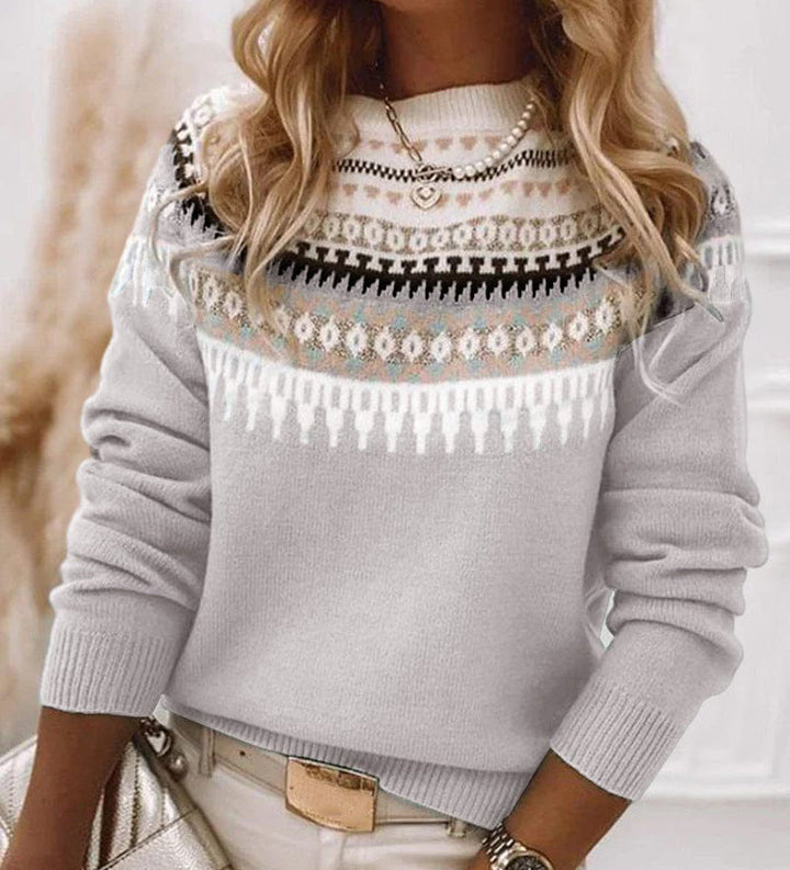 Comfortable and elegant women's sweater with a simple pattern, featuring a round neckline