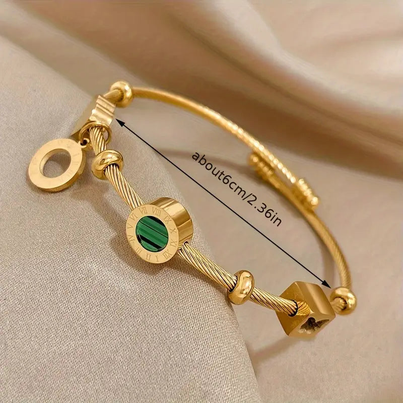 Gold Band with a Green Gemstone
