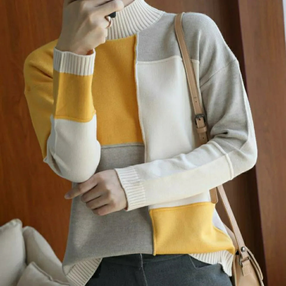 Cashmere sweater with a turtleneck in geometric color blocks