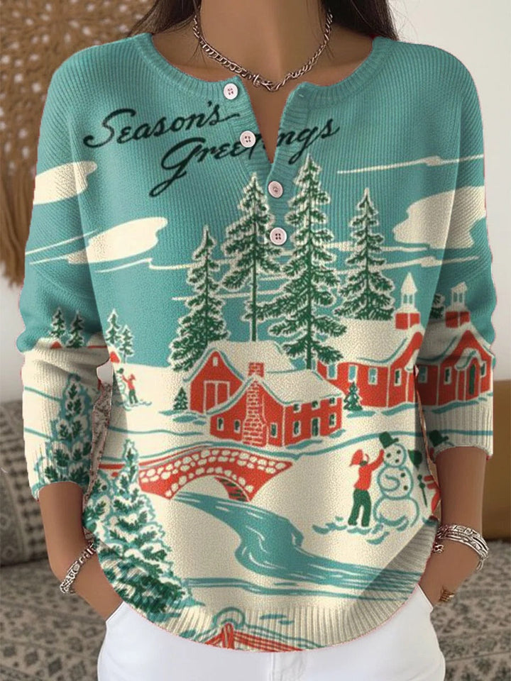 Elegant and comfortable blue sweater with a snow village pattern, slightly open neckline, and button closure