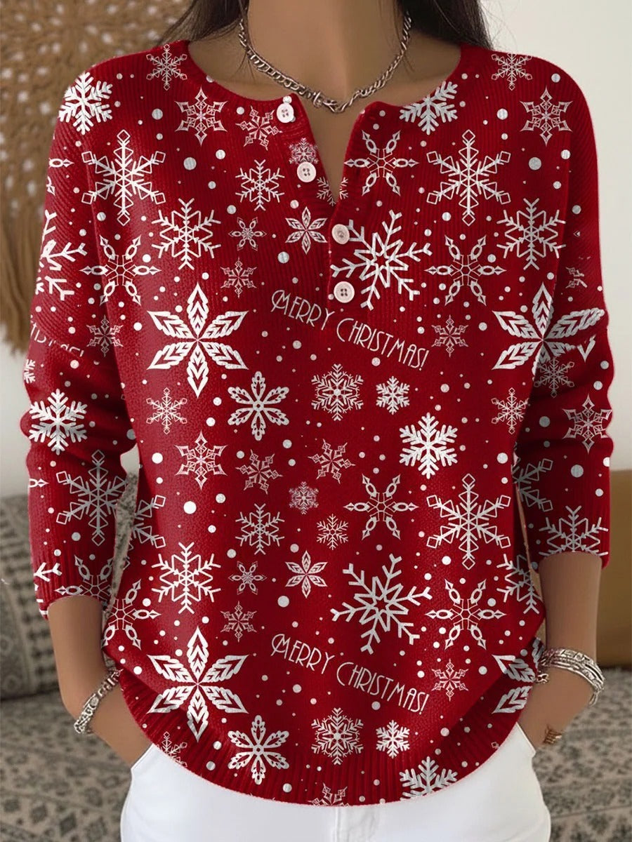 Elegant and comfortable red sweater with a snowflake pattern and decorative buttons at the neckline