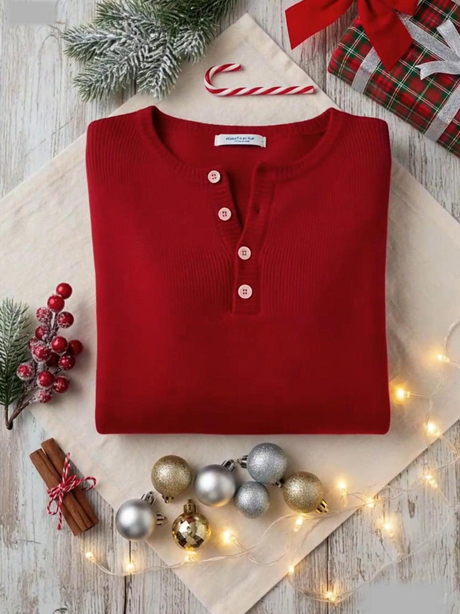 Elegant and comfortable sweater in carmine red with decorative buttons at the neckline
