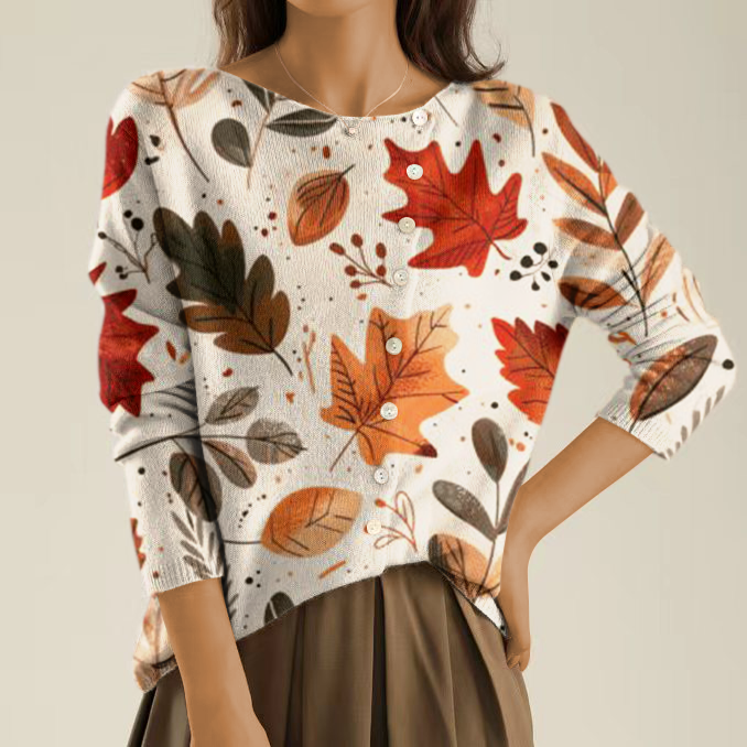 Elegant and comfortable light beige sweater with a multicolored leaf pattern and irregular buttons