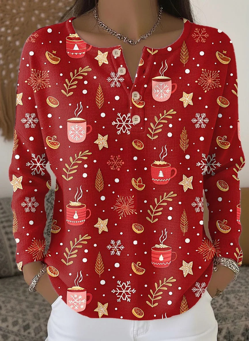 Elegant and cozy red sweater with a mug and snowflake pattern and decorative buttons at the neckline