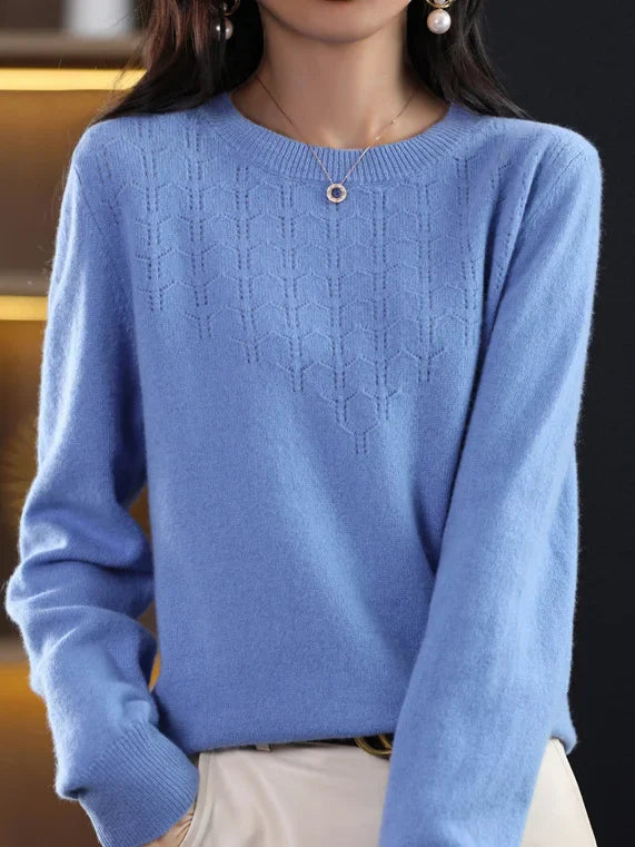 Loose solid color sweater with a round neckline