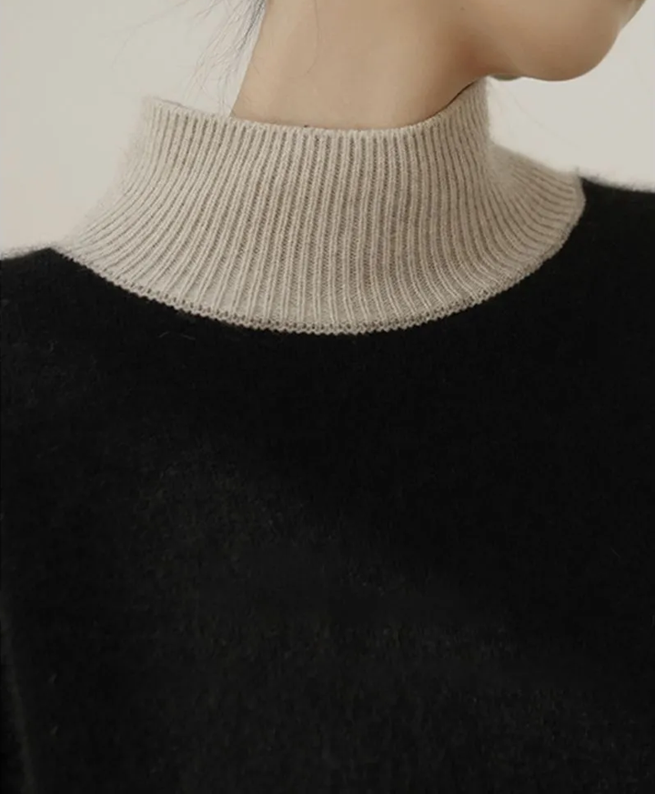 Elegant and beautiful two-tone cashmere turtleneck sweater in color blocks