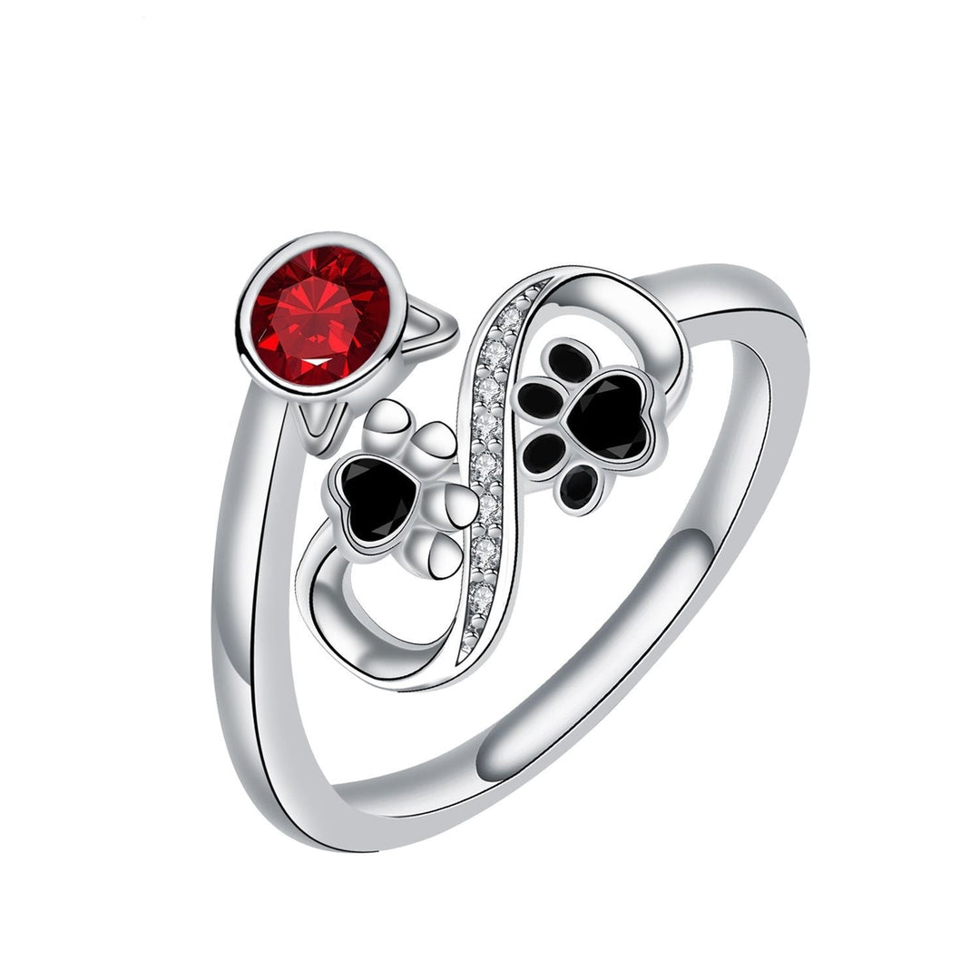 Adjustable ring with black cat paws and red gemstone