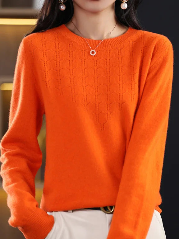 Loose solid color sweater with a round neckline