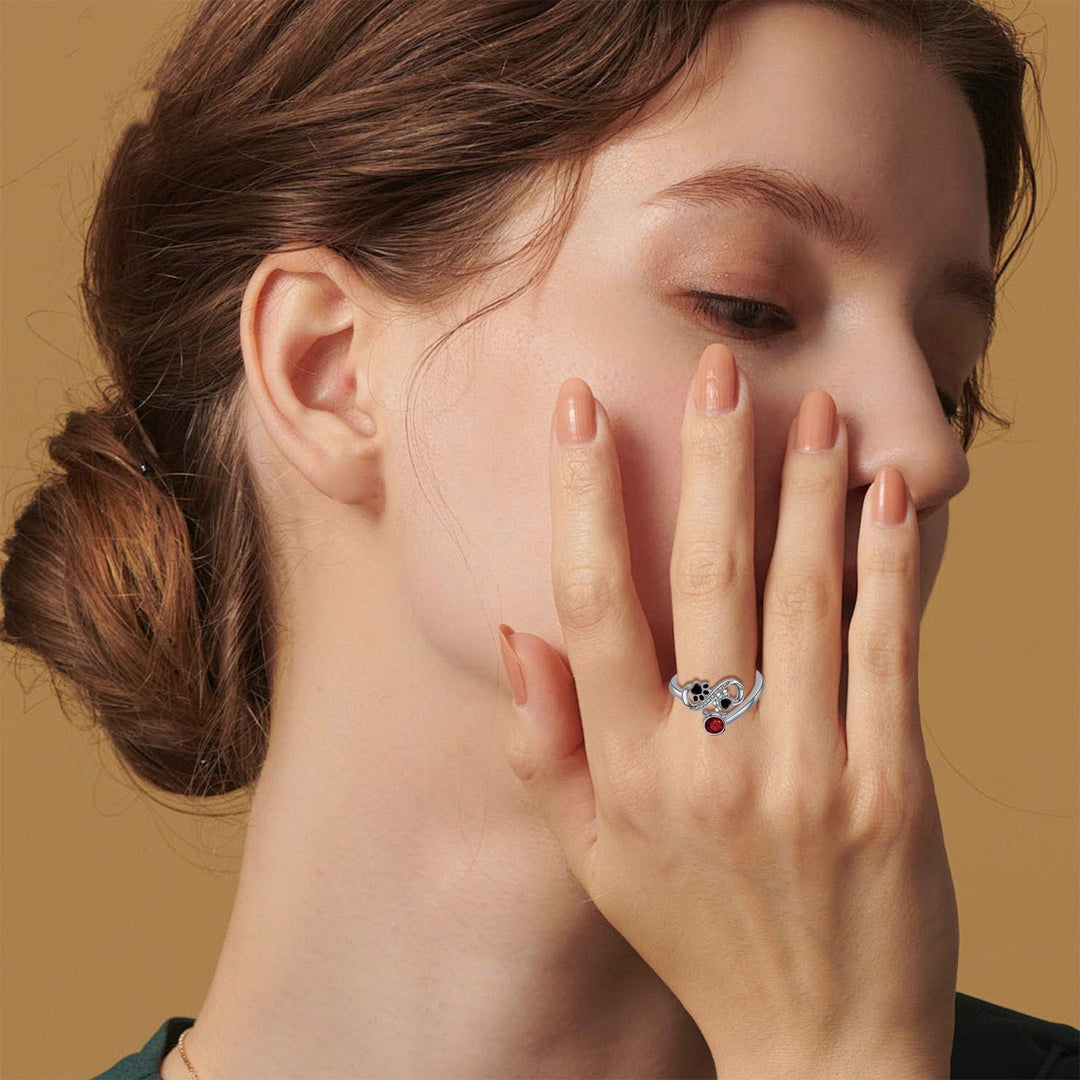 Adjustable ring with black cat paws and red gemstone