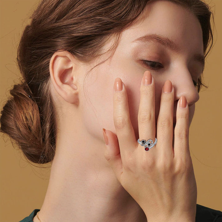 Adjustable ring with black cat paws and red gemstone