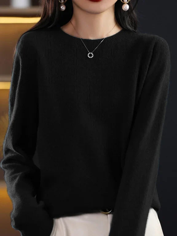 Loose solid color sweater with a round neckline