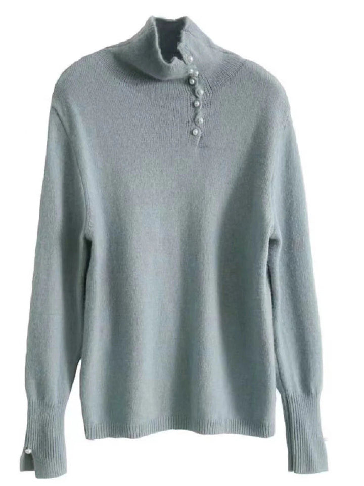 Simple and comfortable women's sweater with a turtleneck, adorned with pearl buttons at the collar