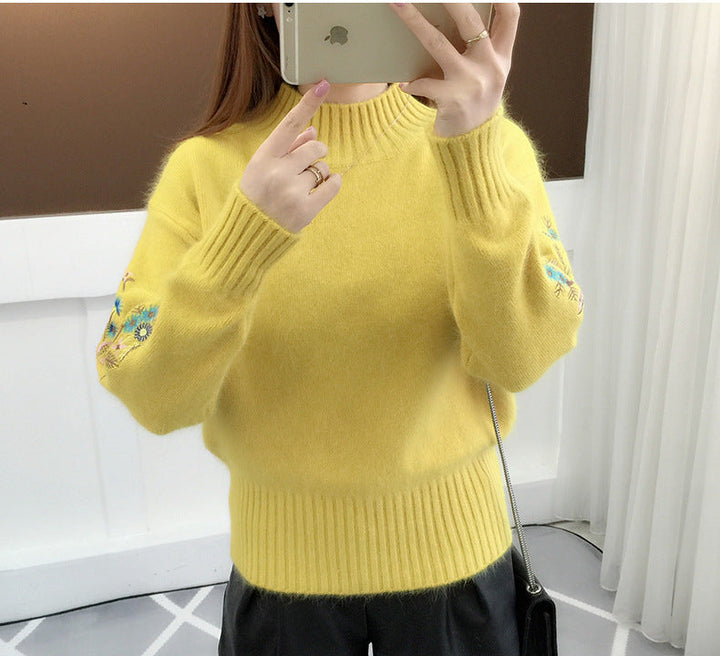 Warm knitted sweater in solid color