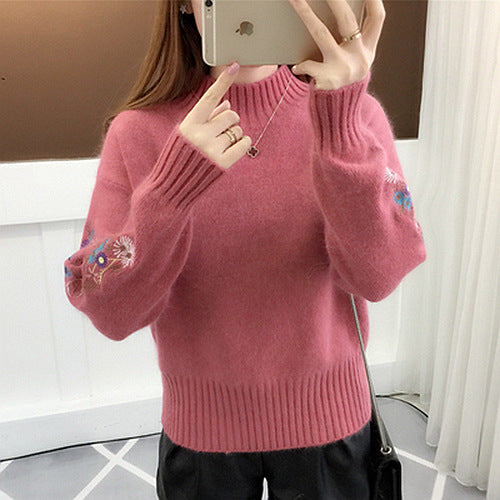 Warm knitted sweater in solid color