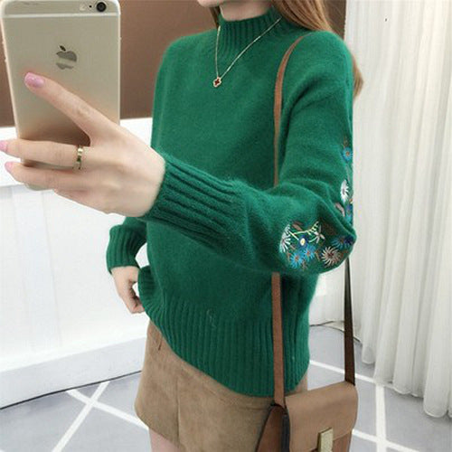 Warm knitted sweater in solid color