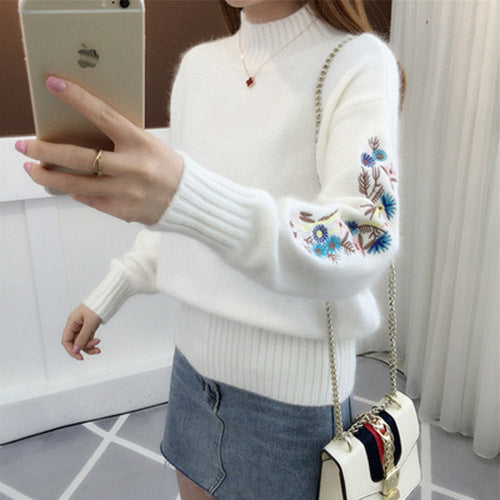 Warm knitted sweater in solid color