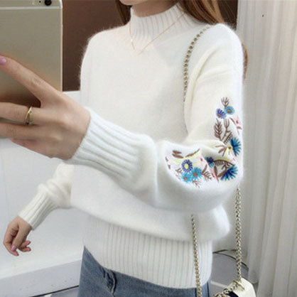 Warm knitted sweater in solid color