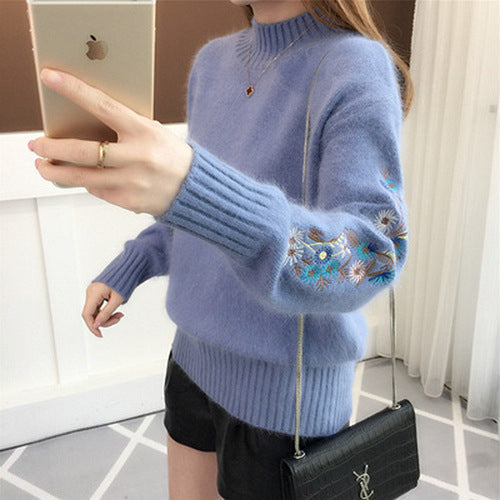Warm knitted sweater in solid color