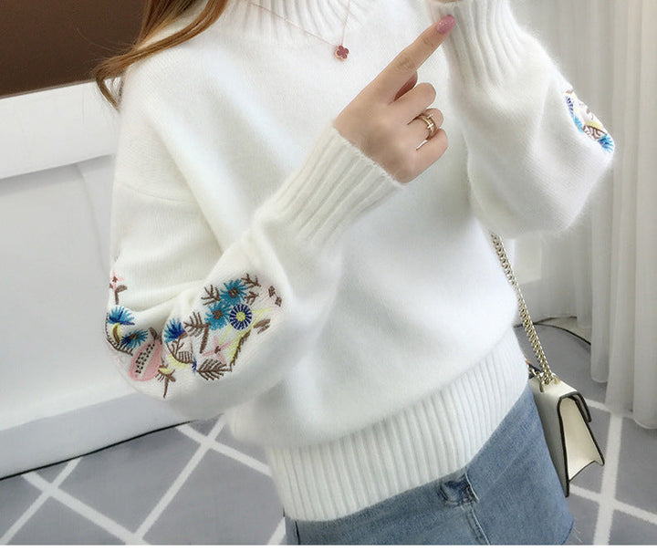 Warm knitted sweater in solid color