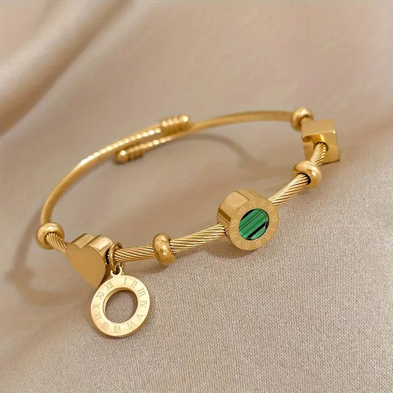 Gold Band with a Green Gemstone