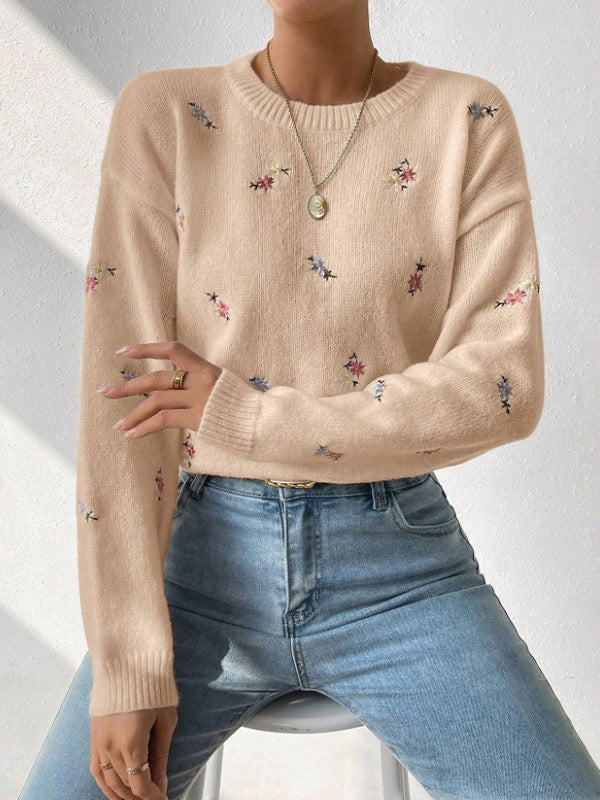 Elegant and comfortable sweater with a round neckline and floral pattern, soft to the touch, versatile and cozy