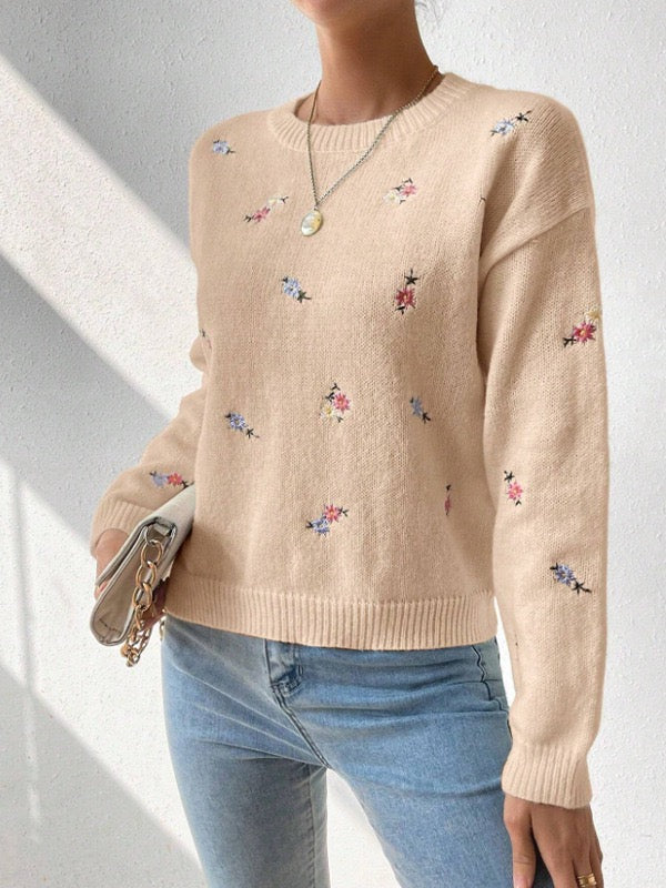 Elegant and comfortable sweater with a round neckline and floral pattern, soft to the touch, versatile and cozy