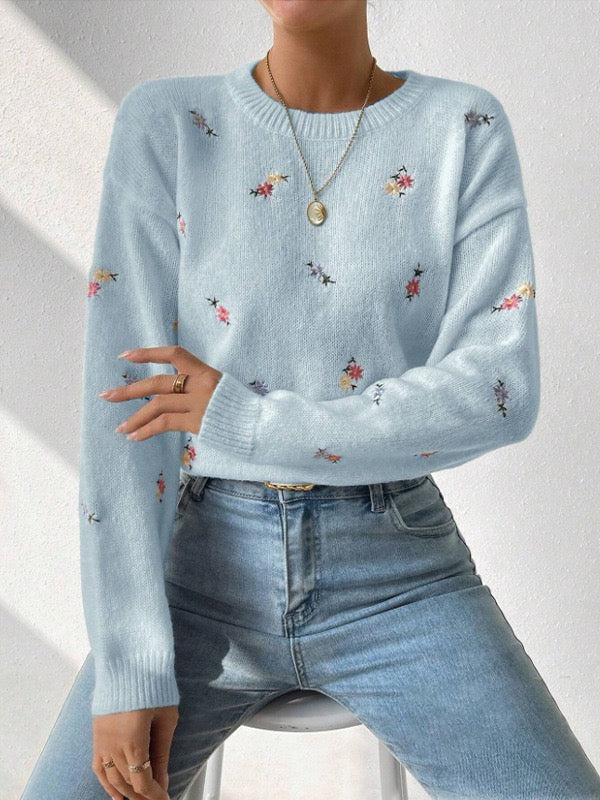Elegant and comfortable sweater with a round neckline and floral pattern, soft to the touch, versatile and cozy