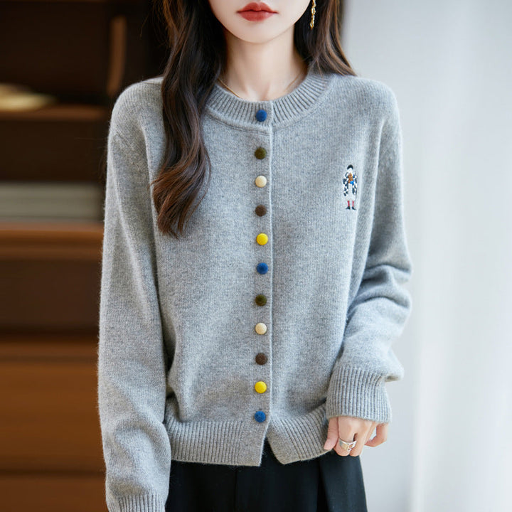Elegant, comfortable, and soft to the touch, solid cardigan with colorful buttons