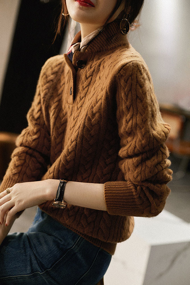 Simple and comfortable women's sweater made of thick knit, in a solid color, with a stand-up collar and buttons