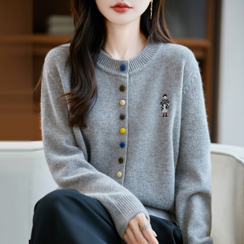 Elegant, comfortable, and soft to the touch, solid cardigan with colorful buttons