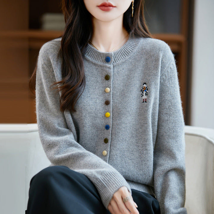 Elegant, comfortable, and soft to the touch, solid cardigan with colorful buttons