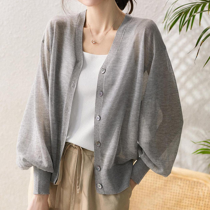Elegant and comfortable, lightweight, breathable women's cardigan in solid color with a V-neck and buttons