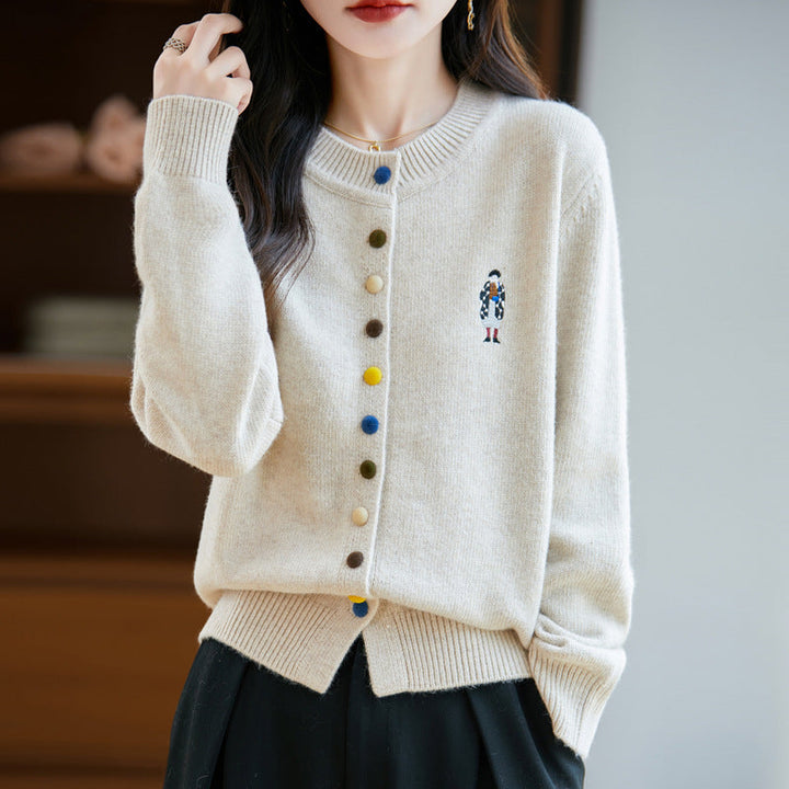 Elegant, comfortable, and soft to the touch, solid cardigan with colorful buttons