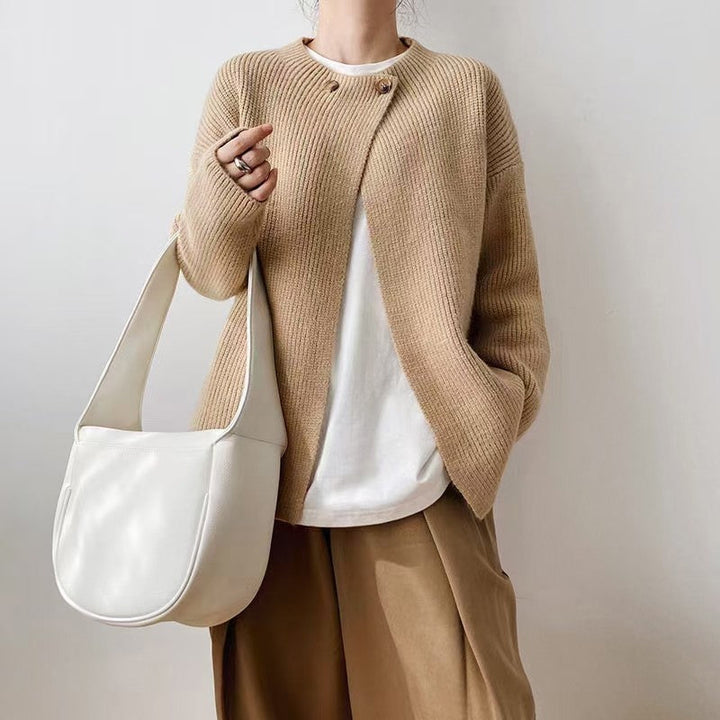 Elegant, insulated poncho sweater in a solid color, button-up