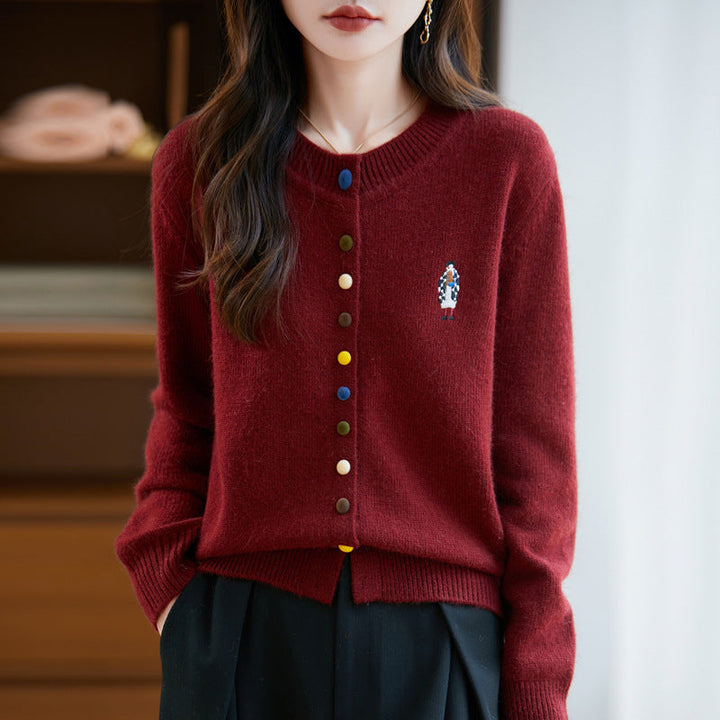 Elegant, comfortable, and soft to the touch, solid cardigan with colorful buttons