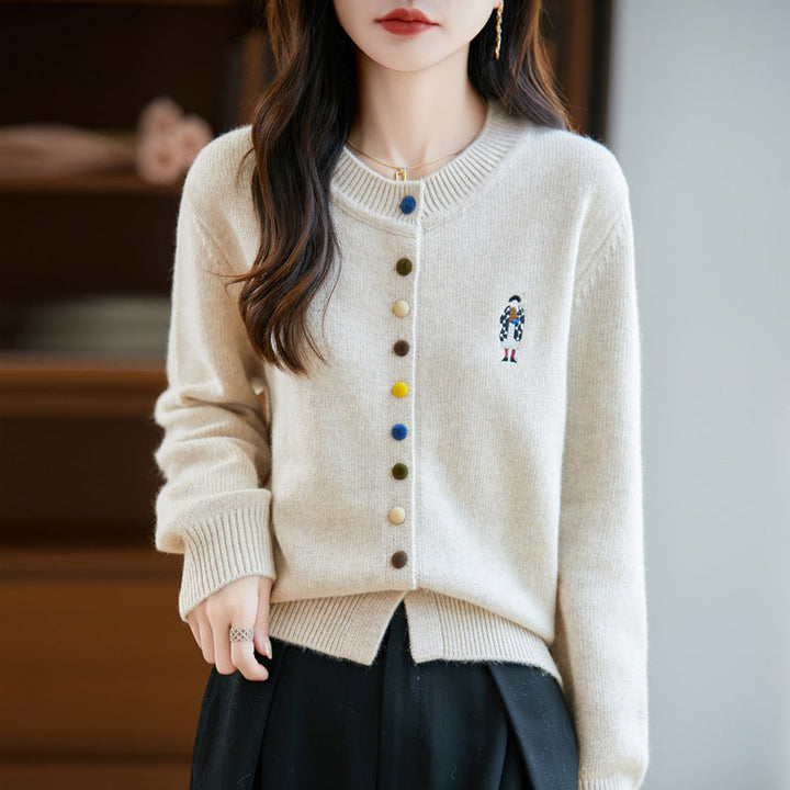 Elegant, comfortable, and soft to the touch, solid cardigan with colorful buttons