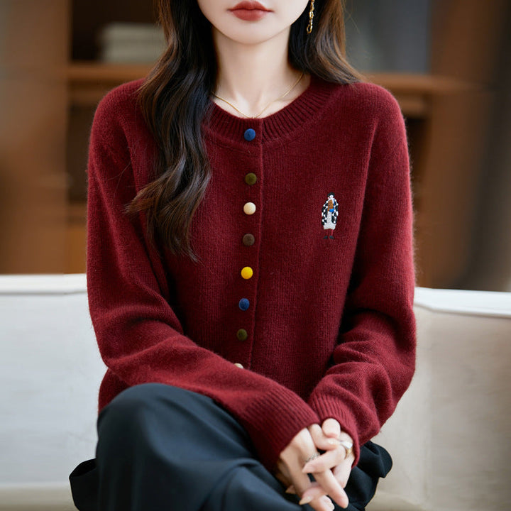 Elegant, comfortable, and soft to the touch, solid cardigan with colorful buttons