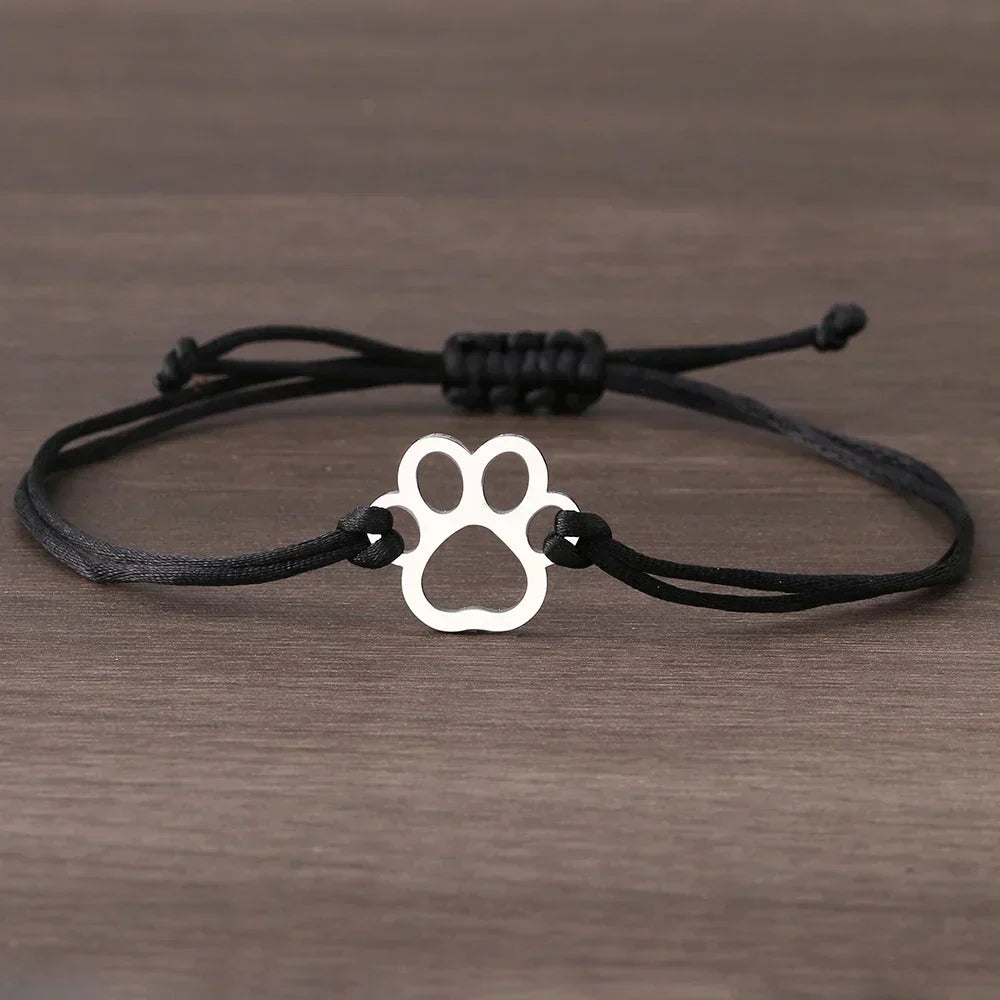 Adjustable bracelet with paw and black and red cord