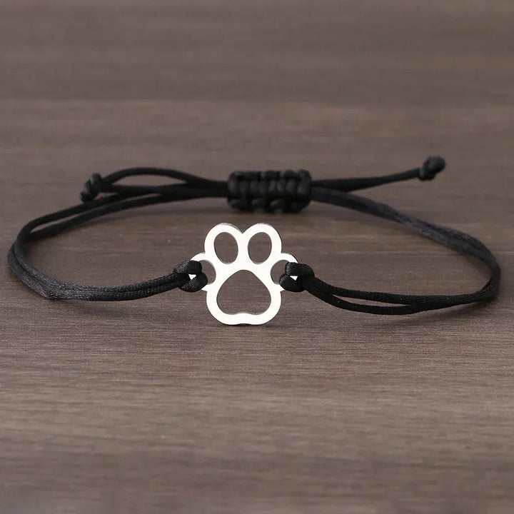 Adjustable bracelet with paw and black and red cord