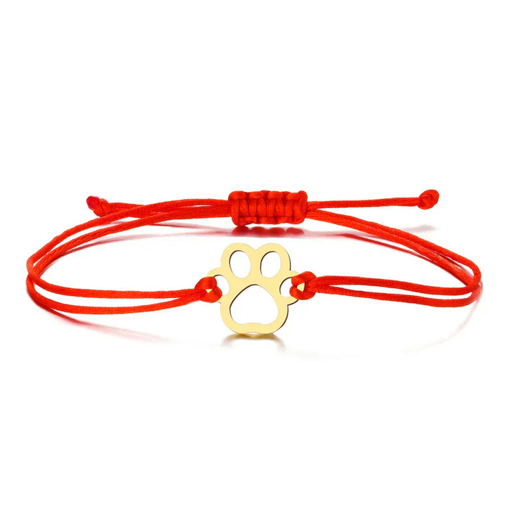 Adjustable bracelet with paw and black and red cord