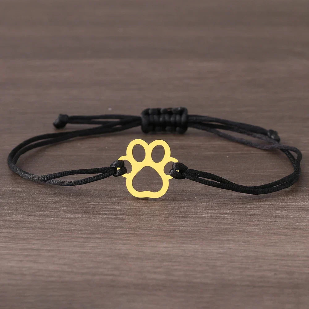 Adjustable bracelet with paw and black and red cord