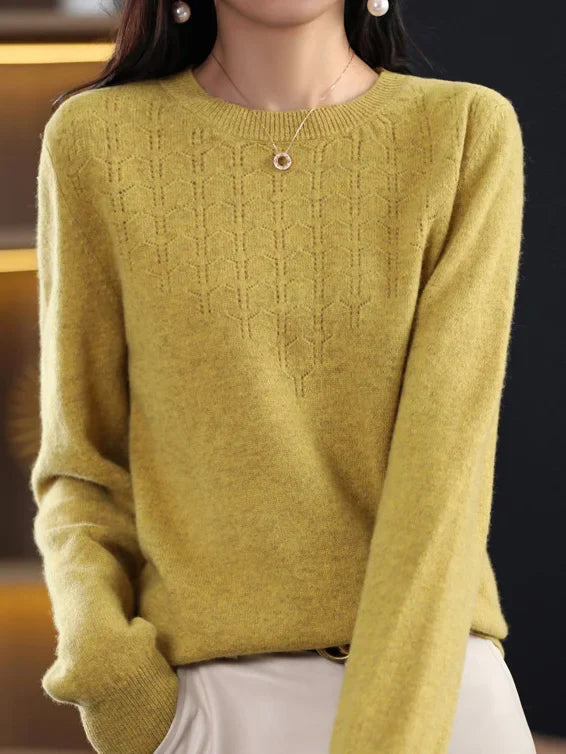 Loose solid color sweater with a round neckline