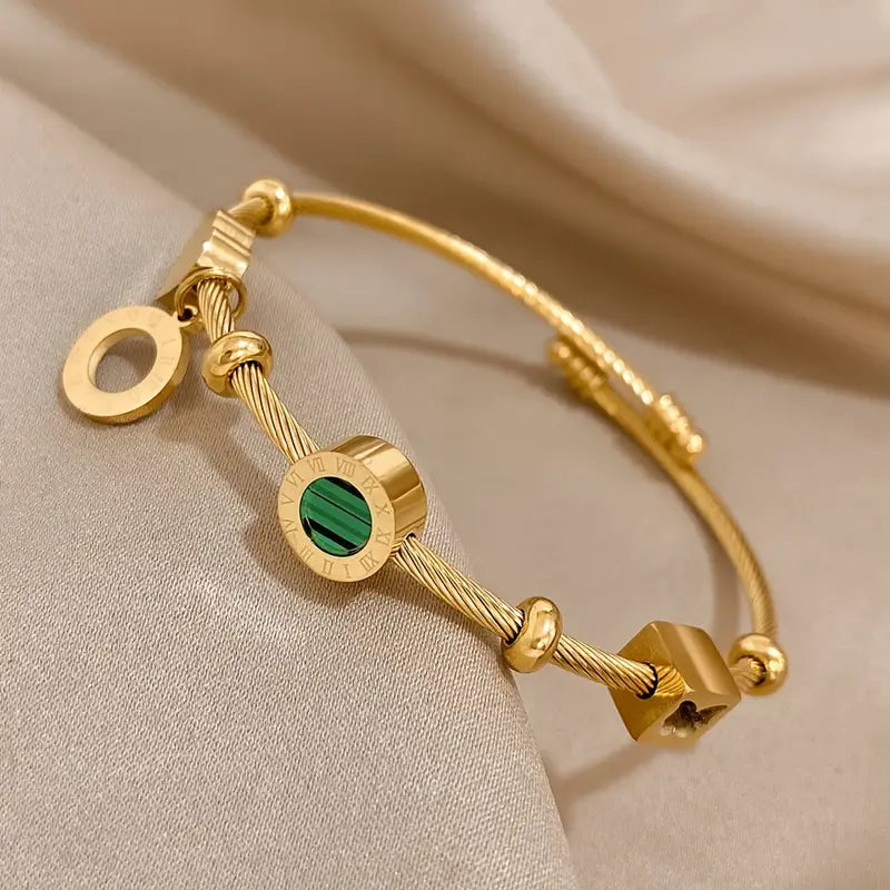 Gold Band with a Green Gemstone