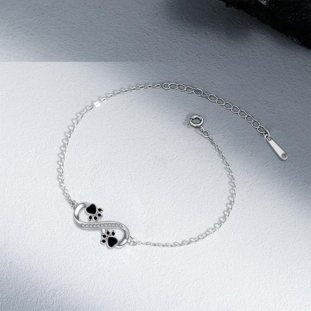 Bracelet with Infinity Symbol, Paw Print Charms, and Zirconia