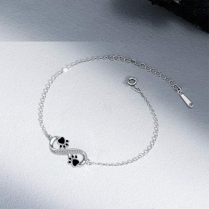 Bracelet with Infinity Symbol, Paw Print Charms, and Zirconia